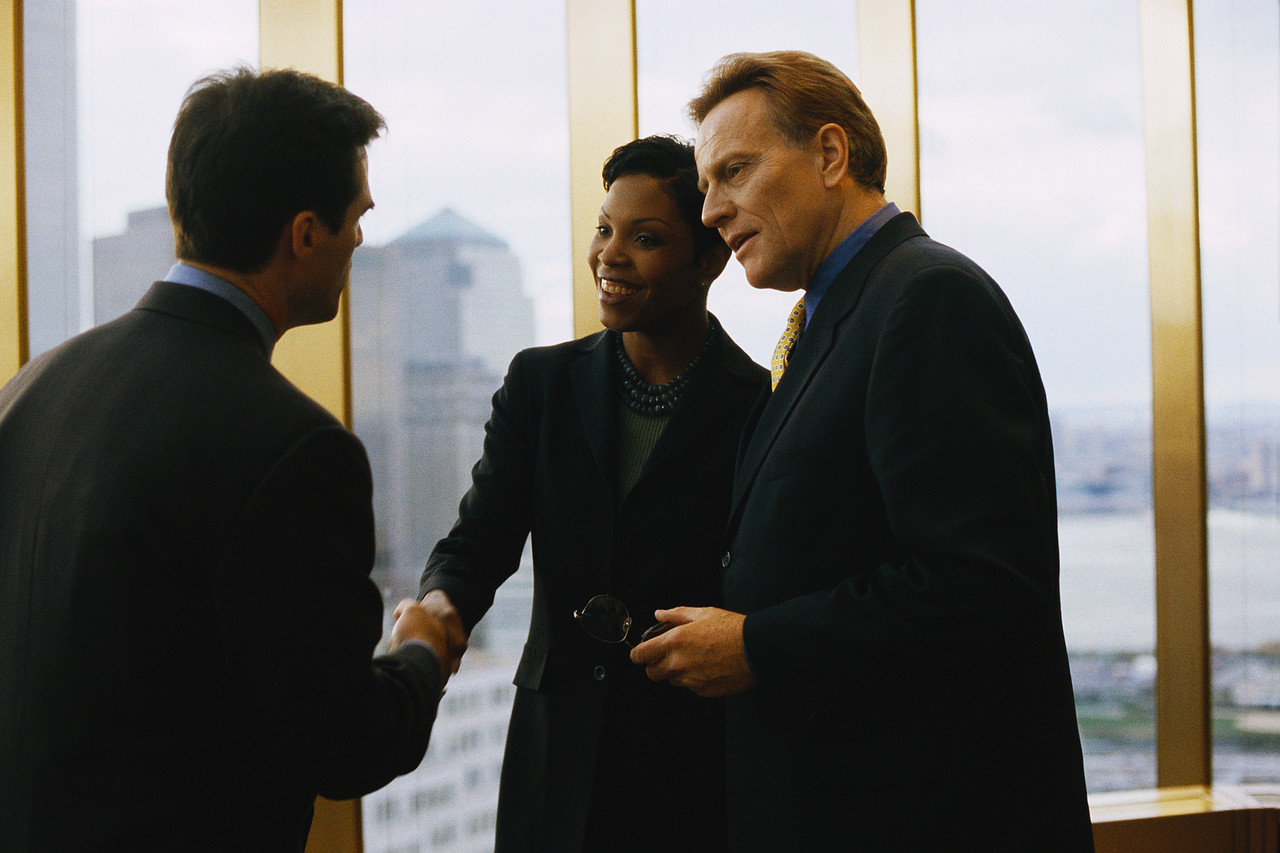 Business People Meeting by Window