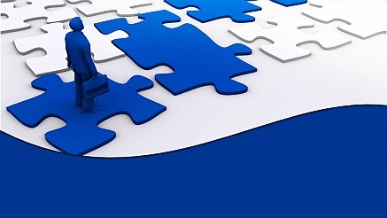 Man walking on puzzle pieces