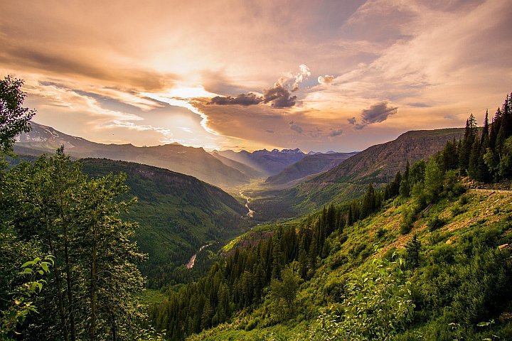 picture of mountainous area with clouds in the sky