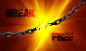 a broken chain with the words break free shown over a sunburst background