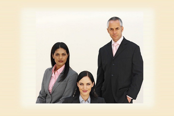 Three Gen X managers in business clothes: one man and two women