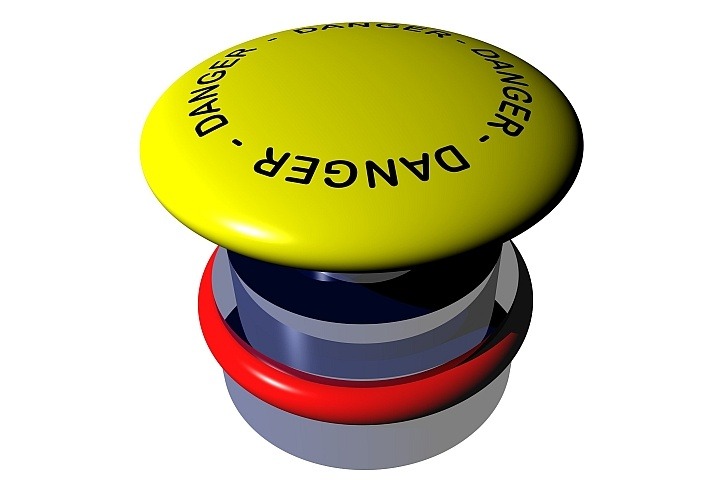 a yellow push button with the word danger written on it