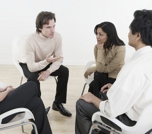 Group of diverse managers sitting and talking