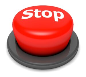 red button with the word "stop" on it