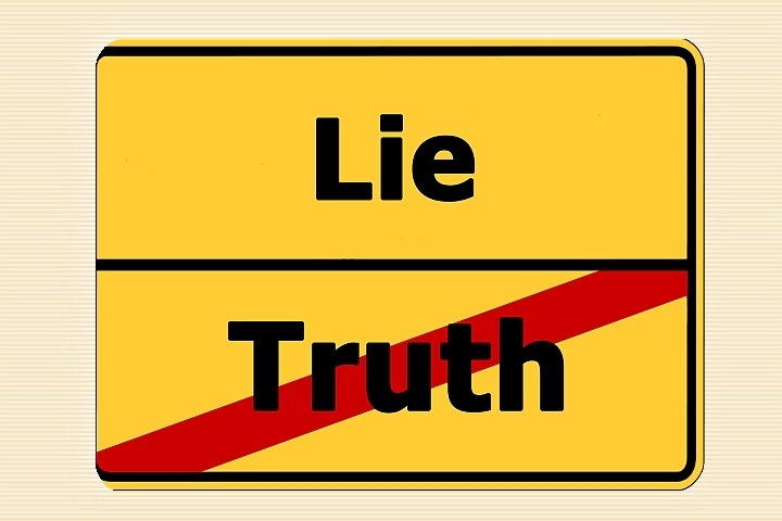 A road sign with the words "lie" and "truth" on it