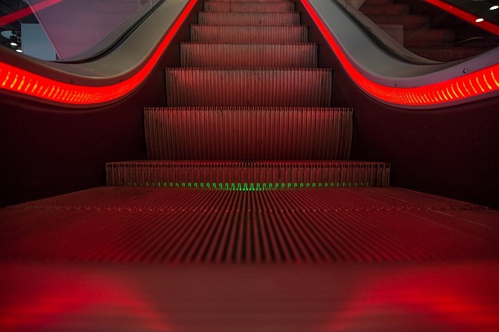 entrance to a red escalator