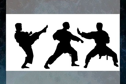 Silhouette image of three men in karate poses