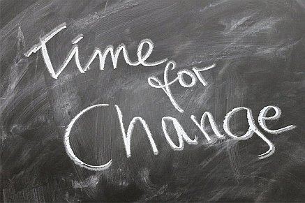 the words "time for change" written on a chalkboard